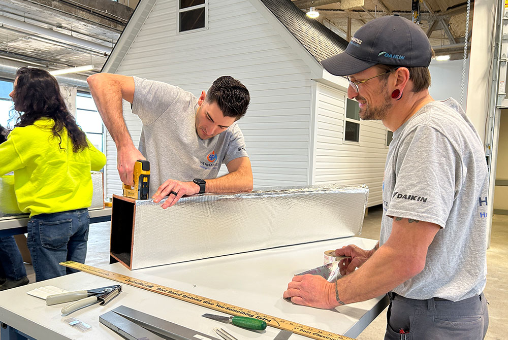HVAC professional learning how to install a heat pump